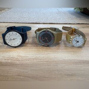 Swatch watches a set of 3 plus a free one that needs a band.. all needs battery.